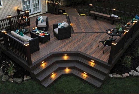 Custom multi-level composite deck I built, featuring integrated stair lighting, modern railings, and multiple seating areas for outdoor ente