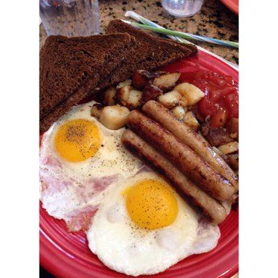 Sunny side up eggs, chicken maple sausage, home fries, toast.