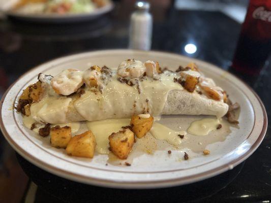 Burrito with shrimp, chorizo and stake and chicken. Plus pineapple