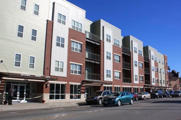 The church is in the commercial space on the far east side of this apartment building.