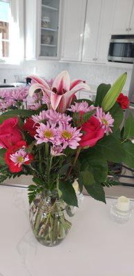 Very tired mums, carnations and 3 roses. Wait til you see the back! Such an embarrassing product from Wilhides!