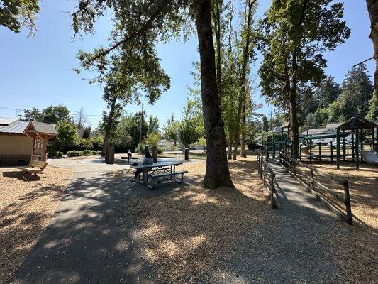 Big kid playscape, splashpad and bathroom from right to left