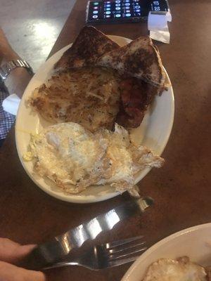 Two eggs and sausage breakfast.