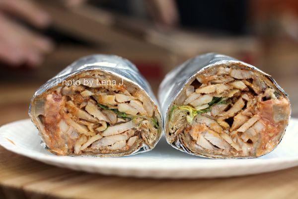 Inside of Chicken Shawarma Wrap without French Fries ($9.95) - lettuce, tomato, onions, pickles, banana peppers, garlic tahini, hot sauce.