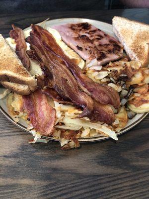 3 Eggs over East, potatoes ordered with onions. Delicious