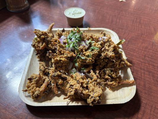 Freshly made mix veg pakora, served with coconut chutney ($9.95).