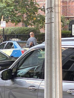 This is a picture of the cab driver. His cab number is number 3679.