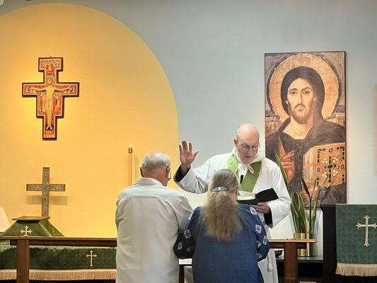 Offering a blessing for a 50th wedding anniversary.