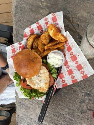Grilled chicken sandwich with potato wedges