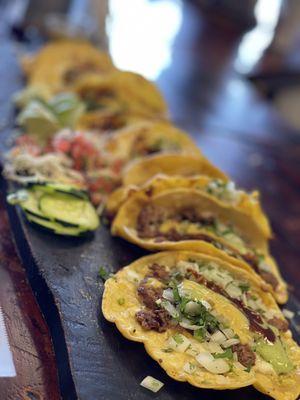 Combo with chicken, chorizo, carne asada, and Al pastor tacos.