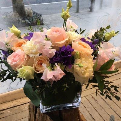 Local purple anemones with garden roses and sweet peas.