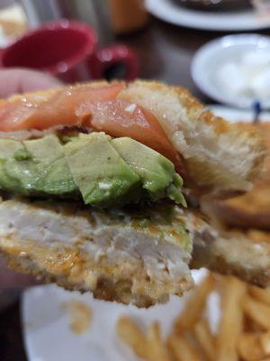 Here is the Ultimate Sandwich with grilled chicken. Bacon, avocado and tomatoes. The bread was grilled with melted cheese.