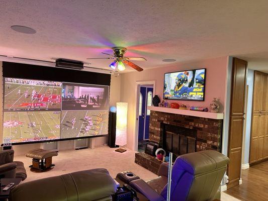 The 120" screen, the AWOL UST projector, and the Samsung 50" The Screen. One of the JBL tower speakers can be seen right of the screen.
