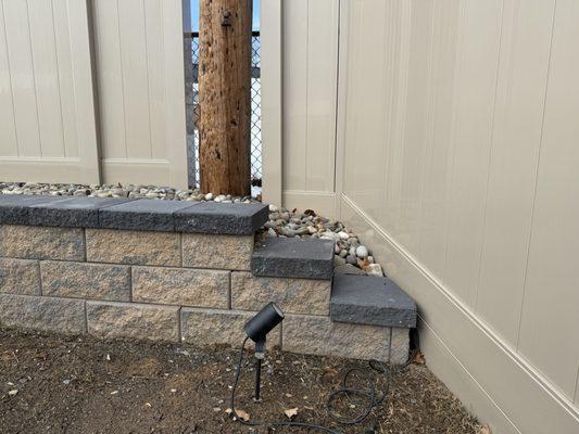 Nice step down at the end of the fence. I decided to use River rock on the top of the wall.