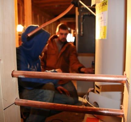 Mike working with Ricky, one of the installers.