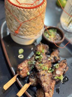 Pork skewers appetizer with sticky rice