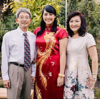 My wine red silk wedding Qipao with hand embeoidered phoenix and peonies.