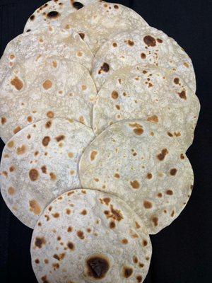 Fresh, warm, and made from scratch - our homemade tortillas are perfect for any meal or available by the dozen to take home.
