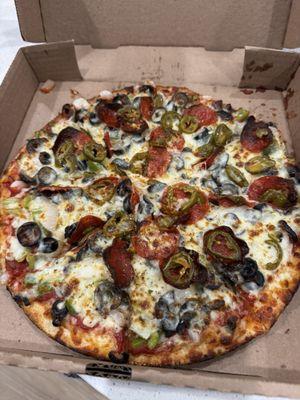 Veggie Pizza, sub green olives for jalapeños, add pepperoni, cook well/crispy.