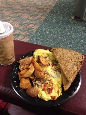 Veggi Omelet...eggs of course, peppers, onions, mushrooms... wheat toast (dry), and potatoes.