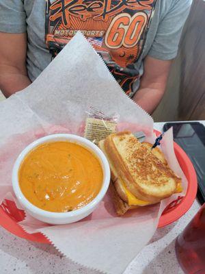 Half sandwich and tomato soup