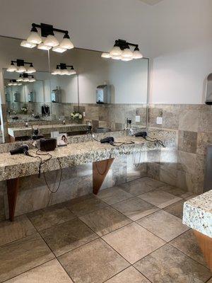 Bathroom area where hair dryers are provided