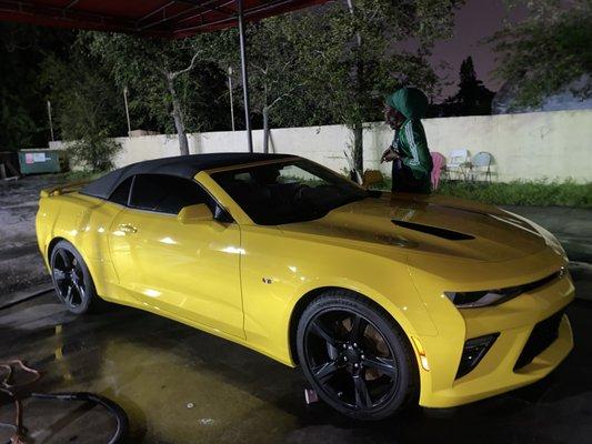 Tafari cleaning my Beast.