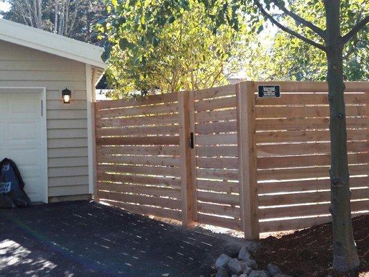 Horizontal fence with custom gate