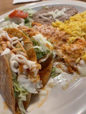Chicken tacos and cheese enchilada with rice and beans