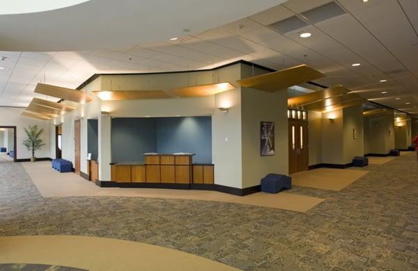 Reception desk doubles as bar and refreshment station for evening and weekend events.