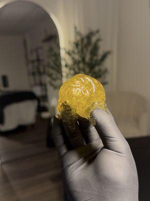 Sugar paste used during hair removal services