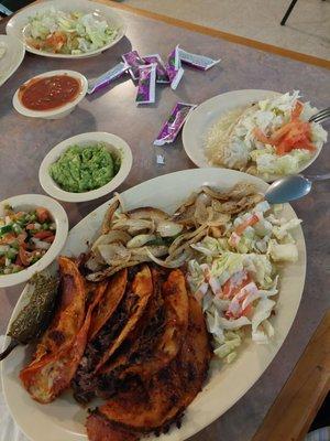 Quesa Tacos- Barbacoa, grilled onions, guacamole & side green tamale