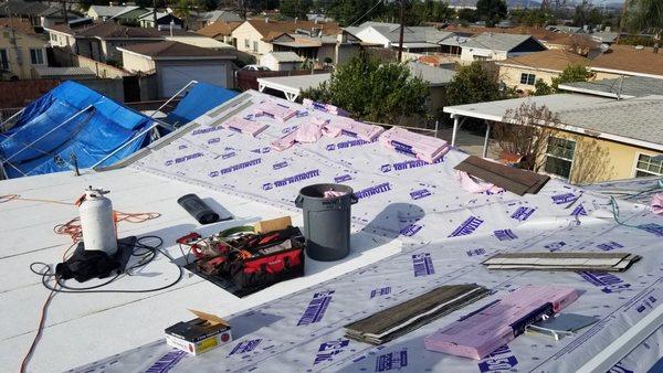 Roofer on-site during scheduled repairs in Cerritos, CA