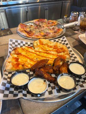 Pizza breadsticks and chicken wings