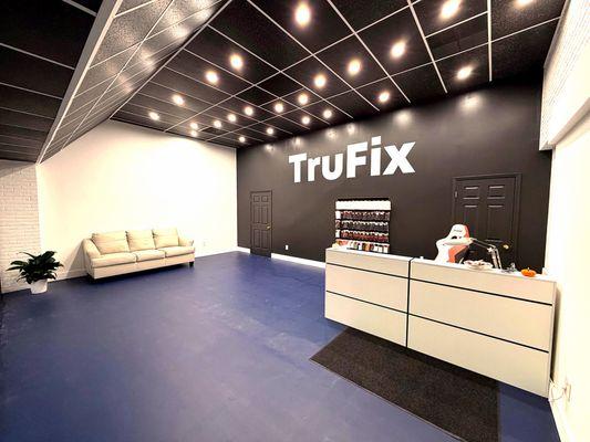 Modern interior of TruFix Phone Repair store in Greenville.