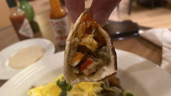 Mini taco as part of the carnitas scramble