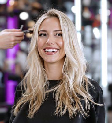 beautiful blonde hair woman smiling at hair salon