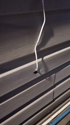 This is how Brinks installer damaged the vinyl siding installing the outside camera
