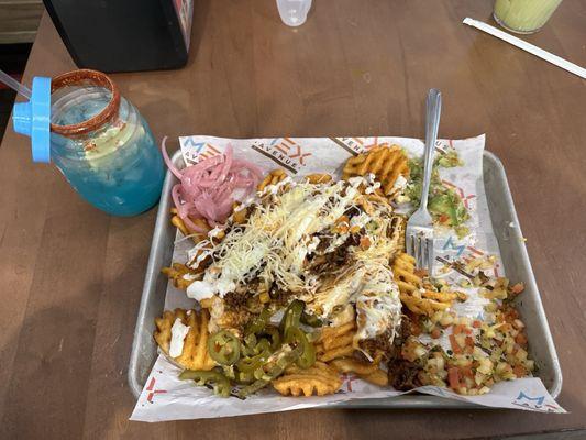 Blue razz margarita and some mex fries