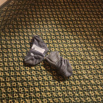 Dirty socks left between the sheets because they didn't even change the linens after the last guest.