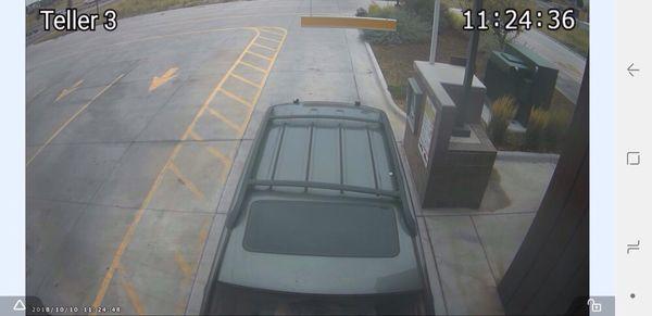 11:24:36 Time Stamped Photo showing the car with no spoiler. Photo is a screen shot from closed circuit camera at the car wash.