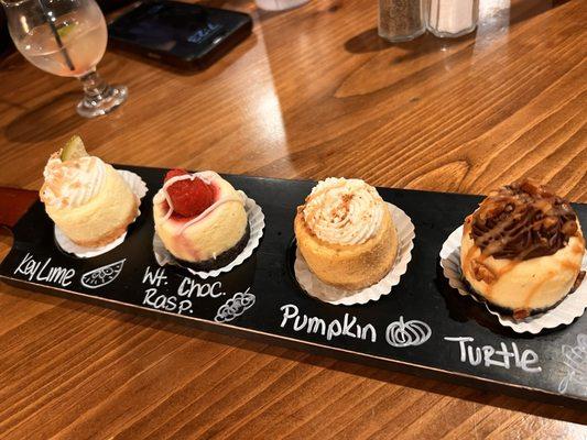 Cheesecake flight . Perfect to share . Cheesecake was creamy & delicious. My favorite was the white chocolate raspberry.