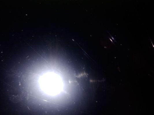 Inside the laundromat it was permanently closed And now it is covered by something dark