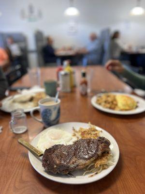 Ribeye steak sunny side eggs hash browns
