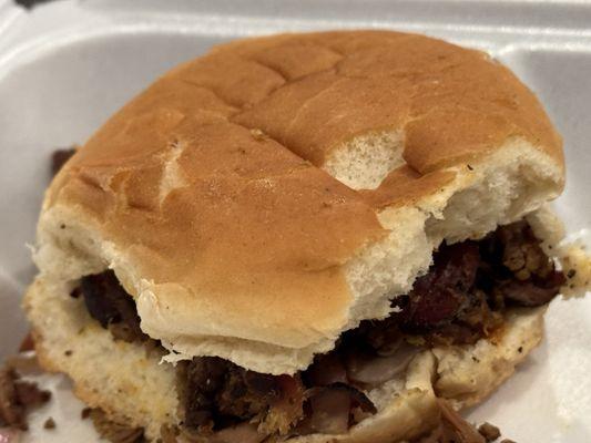 The Squealer. Pulled pork sandwich with onions, bread and butter pickles and a special sauce