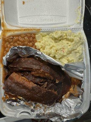 Rib plate with potato salad and baked beans. You get a side of white bread or cornbread. The sauce can also be served on the side