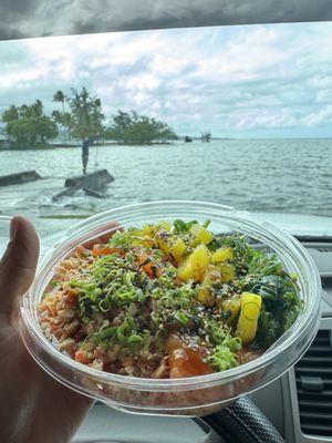 Sushi bowl with salmon and butter garlic crab