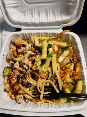 Chicken bowl with noodles and added spicy pineapple teriyaki sauce