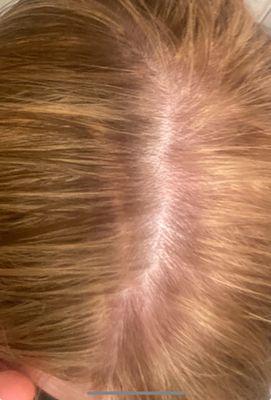 My $300+ "blonde" highlights by Tina. One of the many lines and weird areas left in my hair after my regrettable experience here.