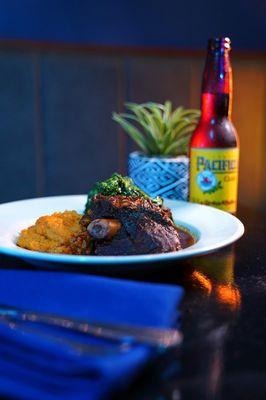 Mixiote de Borrego: Steam Lamb Shank Mixiote, borracho pinto beans,
 steamed sweet potato purée, and sautéed broccoli
 rabe